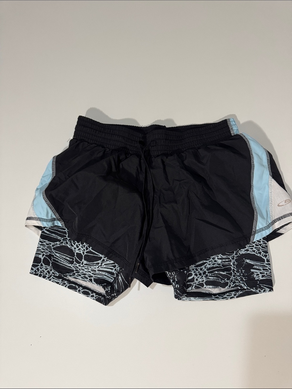 Woman’s Black Athletic Layered Running Shorts with Light Blue Accent